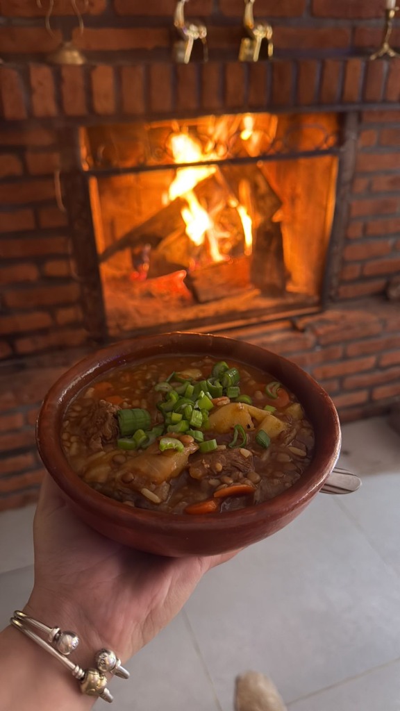 Hearty Patagonian stew by the fireplace